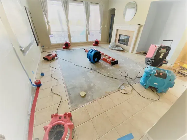 Air movers and dehumidifiers drying a Malibu room