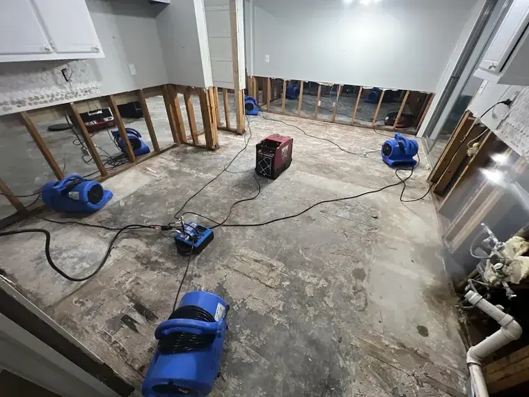 Muddy debris-flow water cleaned from a Malibu canyon home